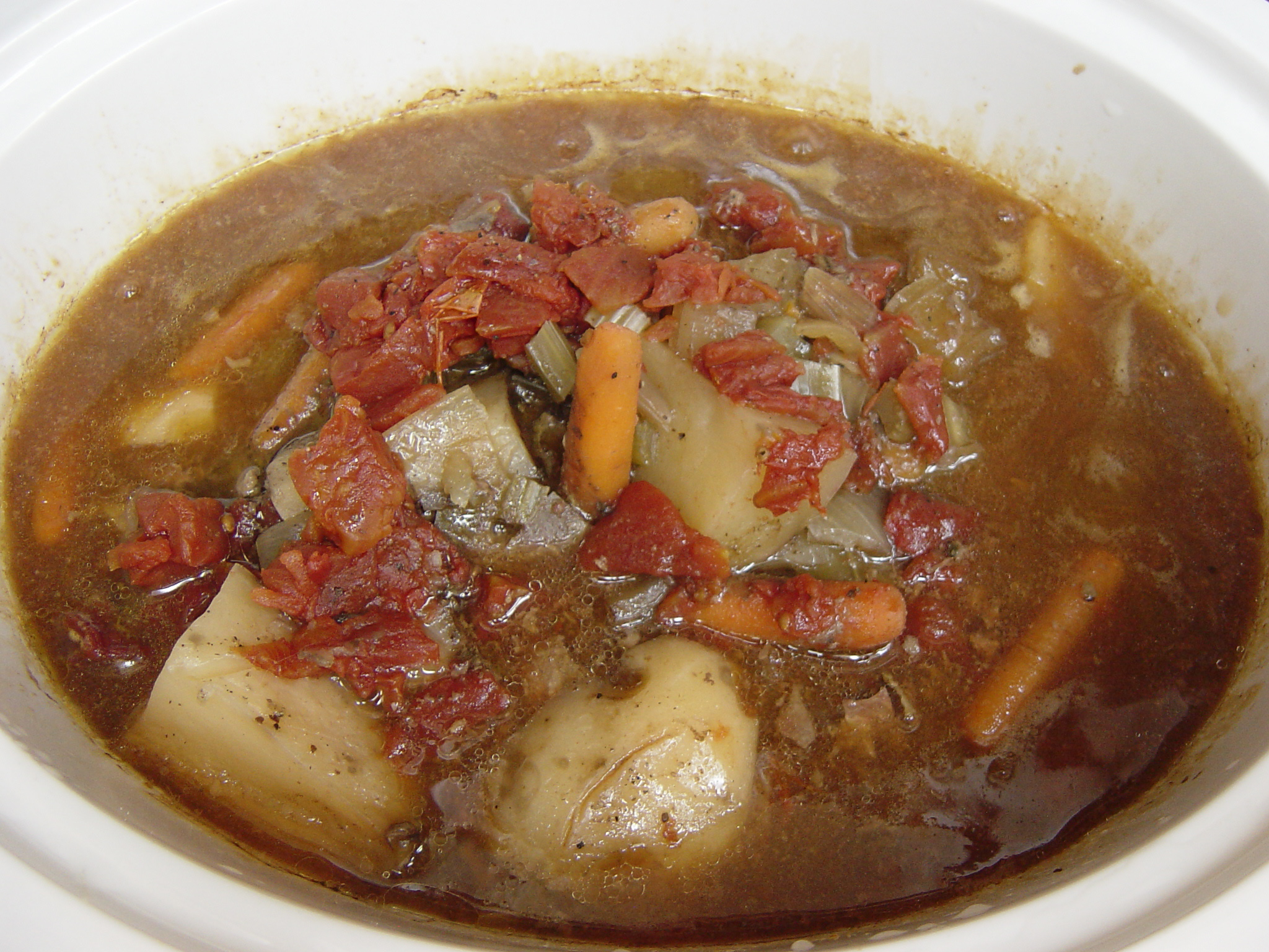 an image of a stew with vegetables in the dish