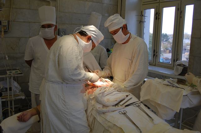 the surgical team is performing  on a patient