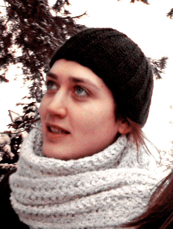 a woman in a beanie, a knitted scarf and cowl