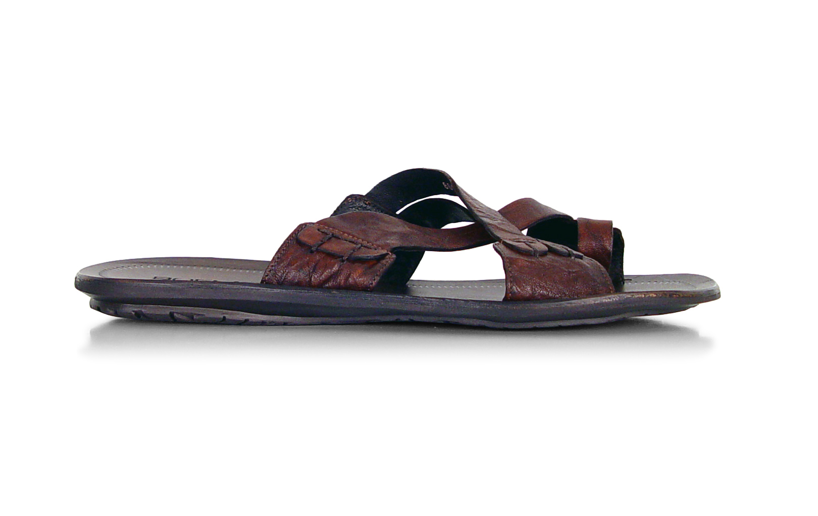 a man wearing sandals and a sandals strap with a brown leather bottom