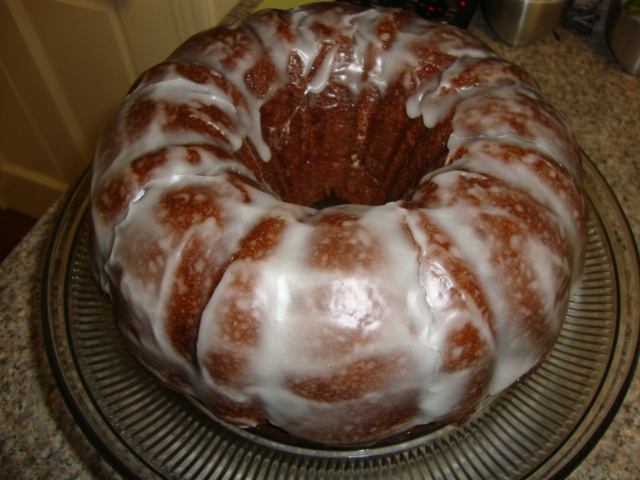 the bunt cake has been frosted with white glaze