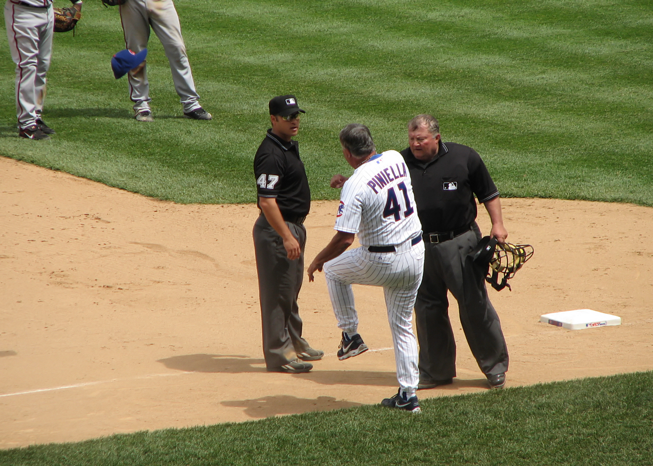 two baseball players and one has a glove