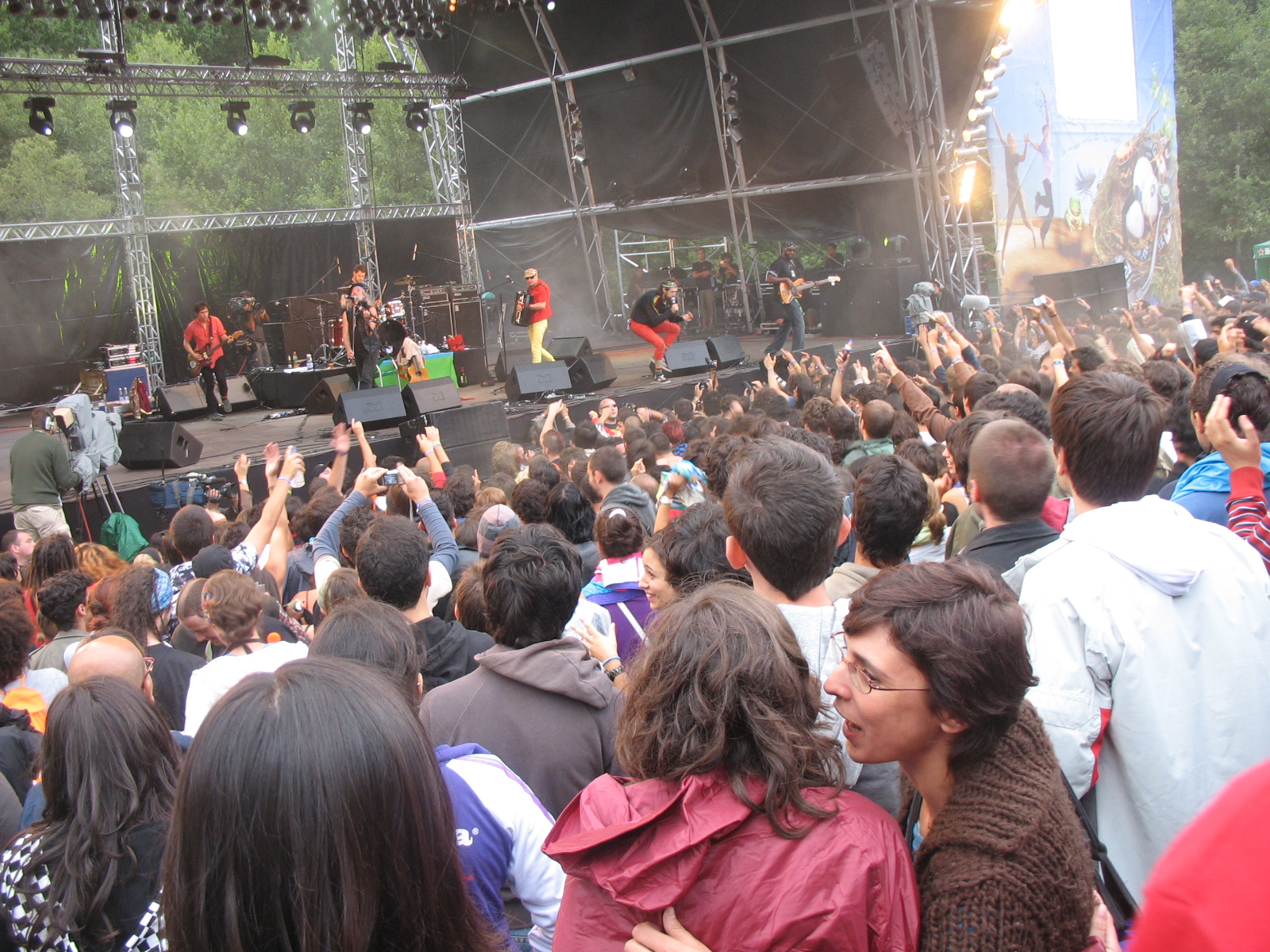 a large group of people gathered around a stage