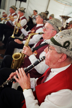 a band with an old man playing saxophone