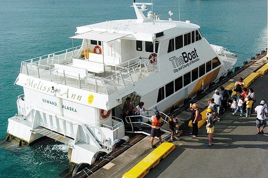 a large white boat floating on top of the ocean