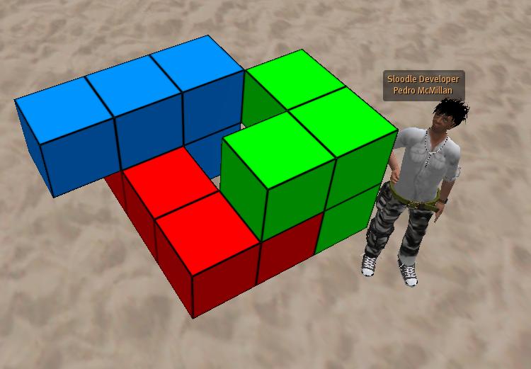 a man standing next to two 3d rubc blocks