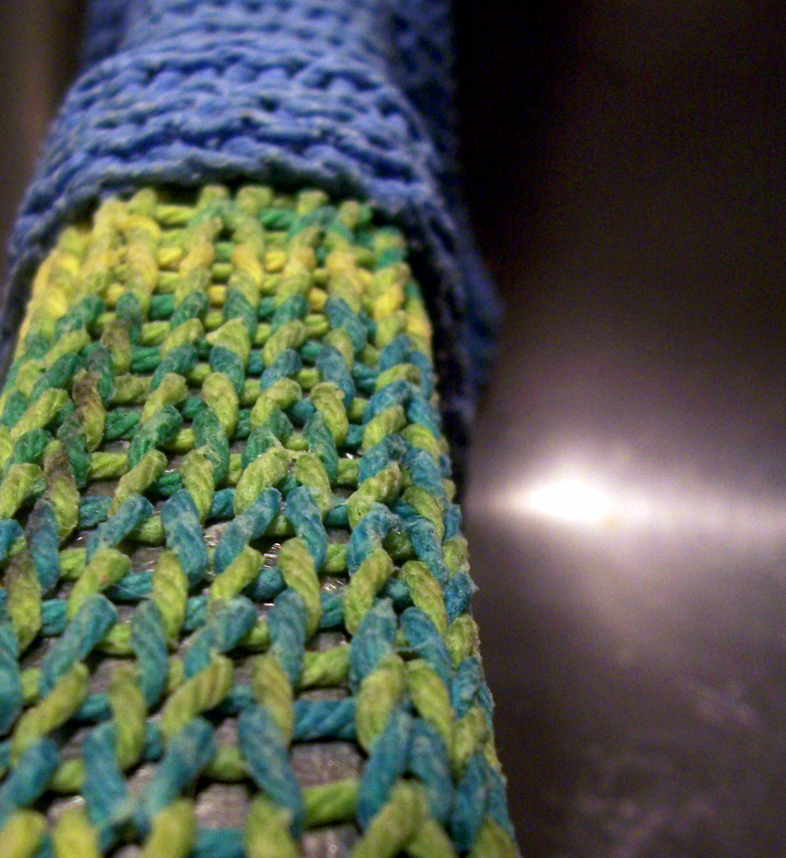 knitted piece of cloth in bright blue and green