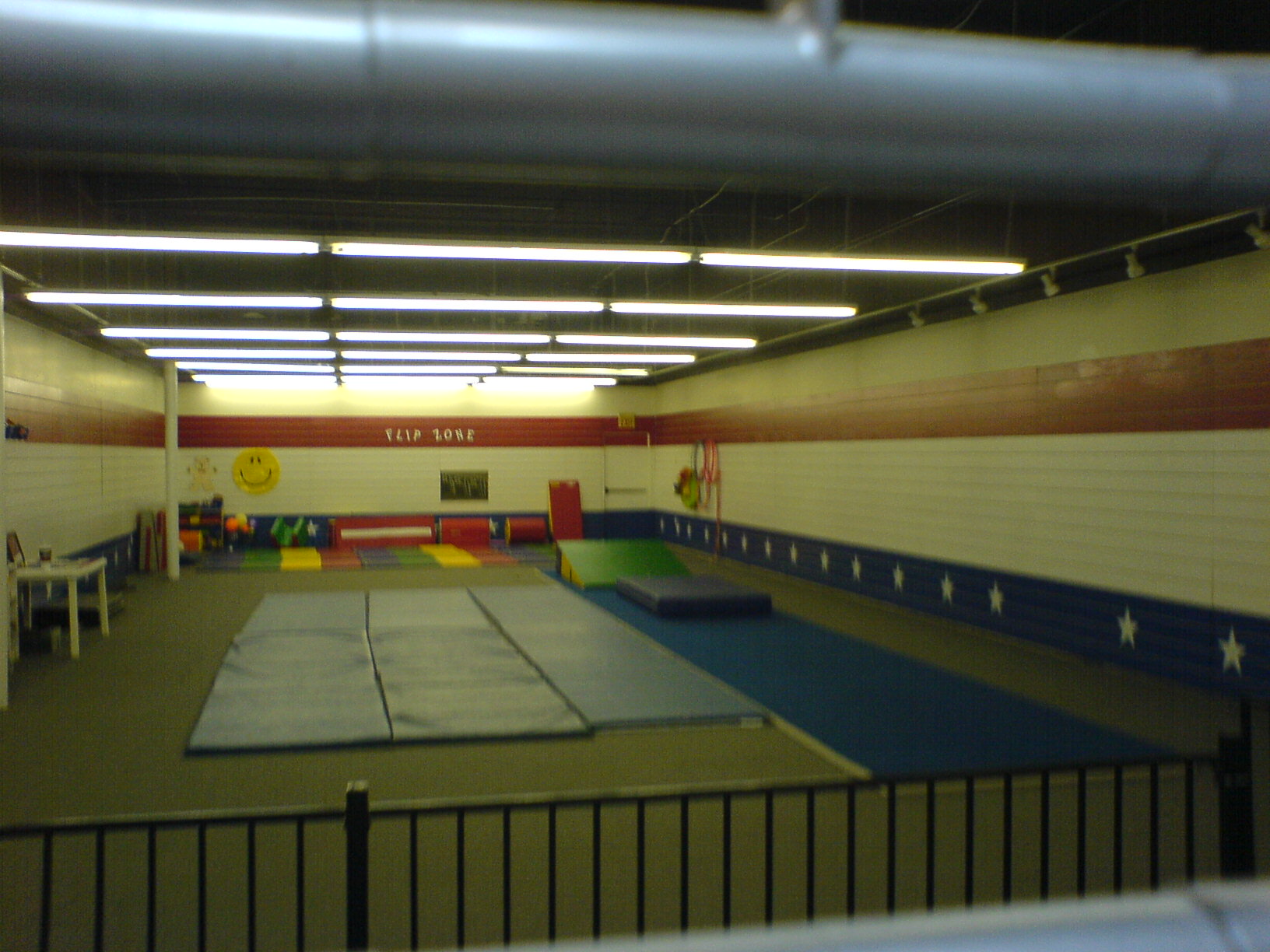 indoor playground with trampoline and large carpet