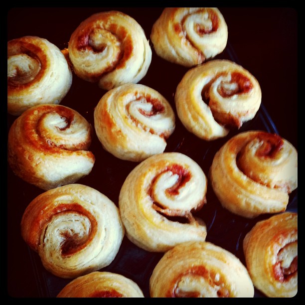 several pastries, filled with meat and tomato sauce