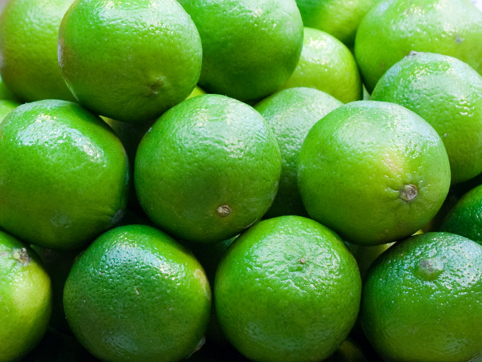 some limes are piled on top of each other