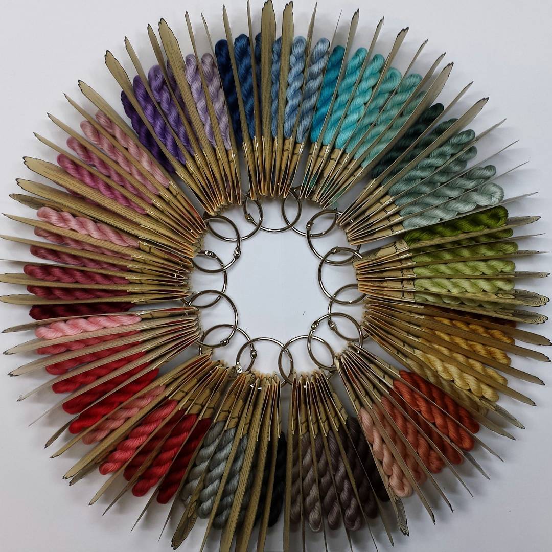 multicolored scissors arranged in a circle