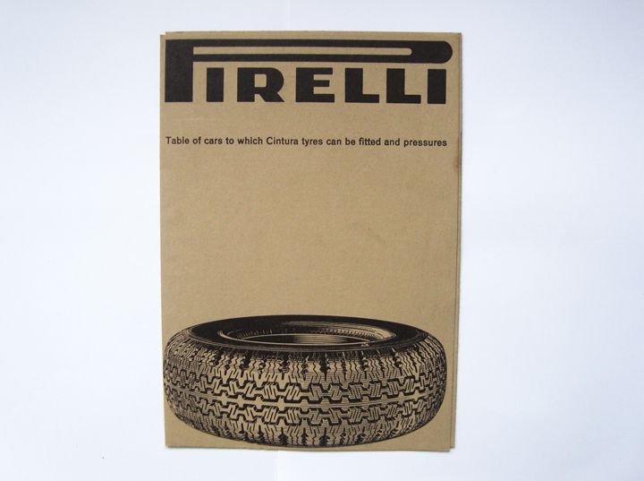a brown cardboard packaging is holding an image of a tire