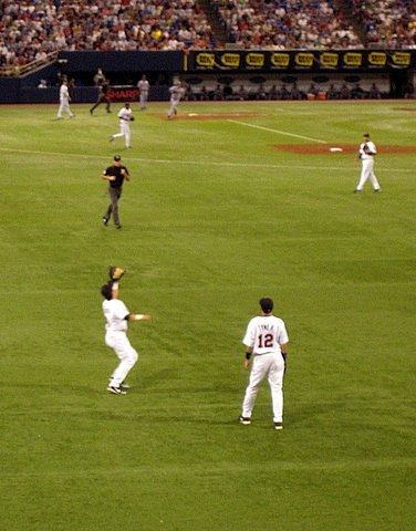 the baseball players are playing a game of baseball