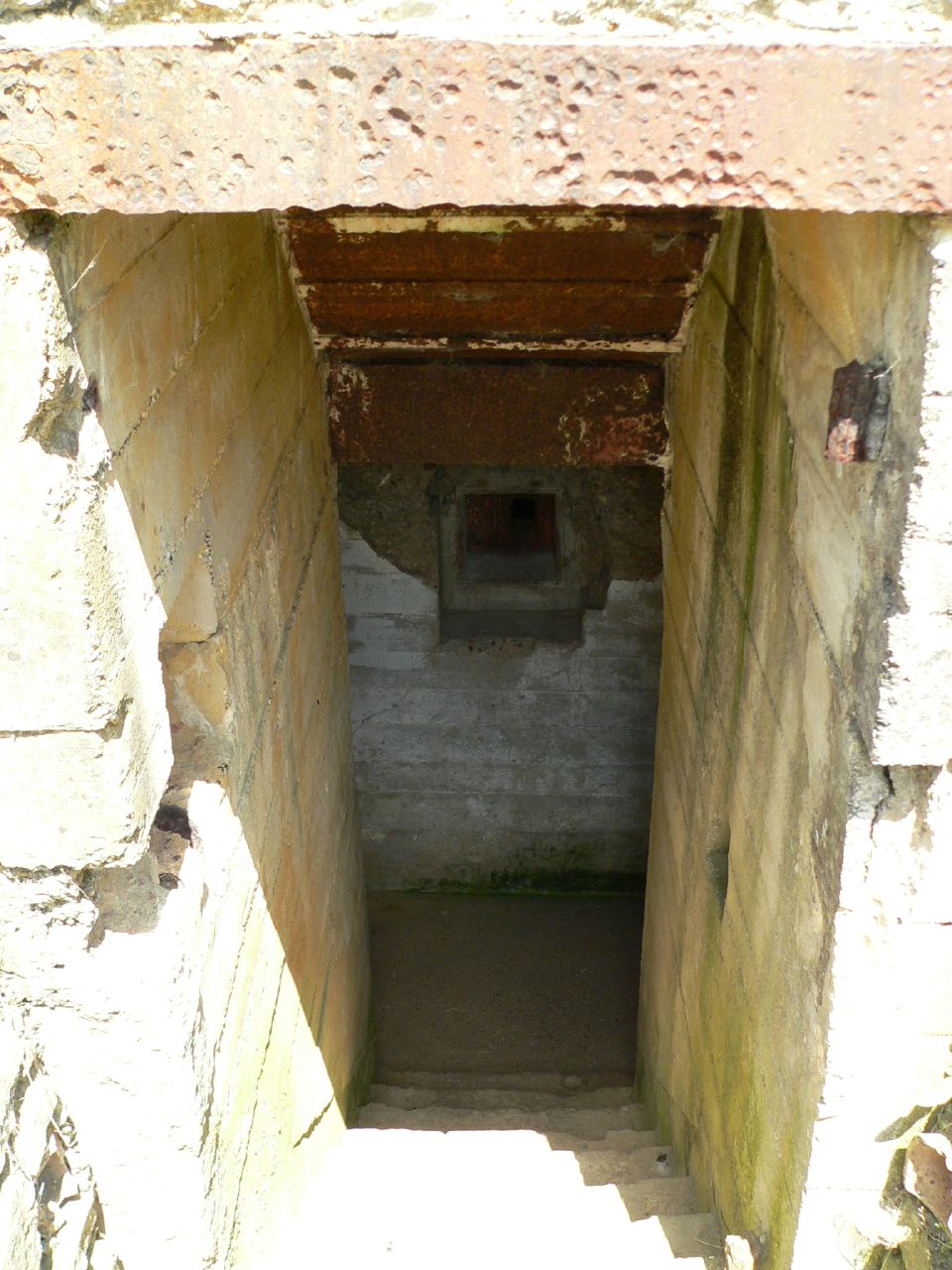 a doorway that is in the side of an old building