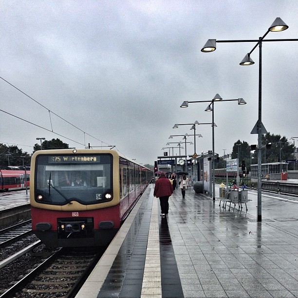 there is a train coming into a station