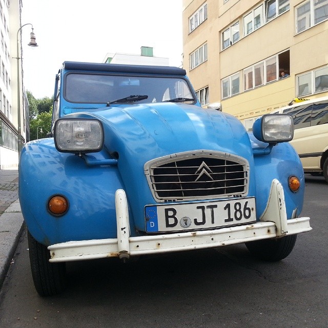 a blue citroen car on street in europe