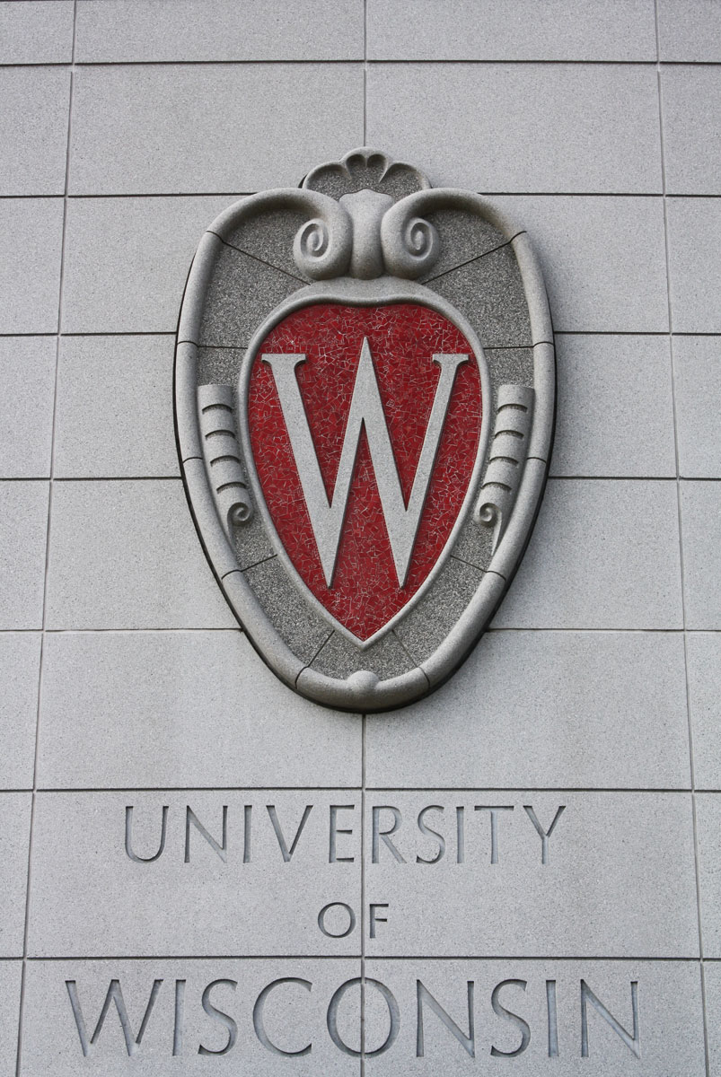 the university of wisconsin emblem and name on a building