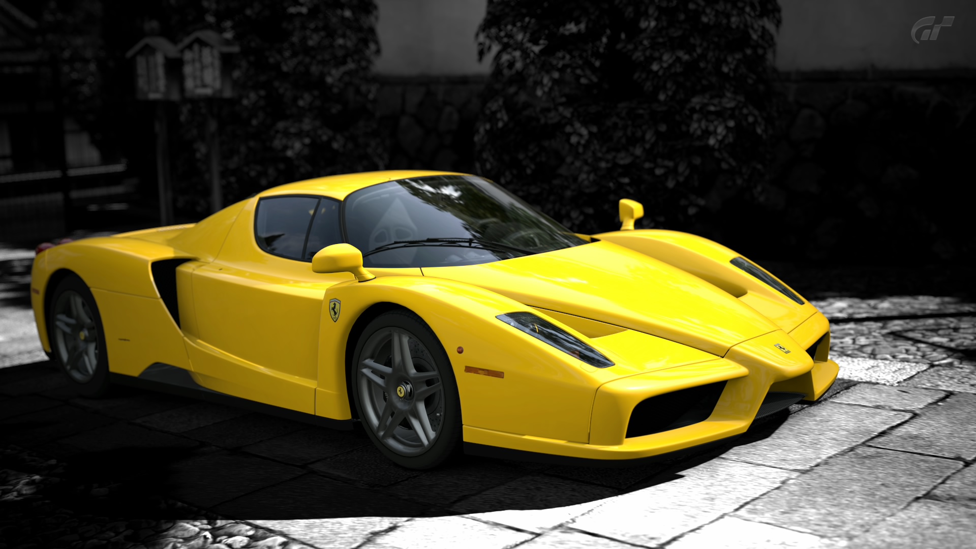 a yellow sport car sitting on the side of a road