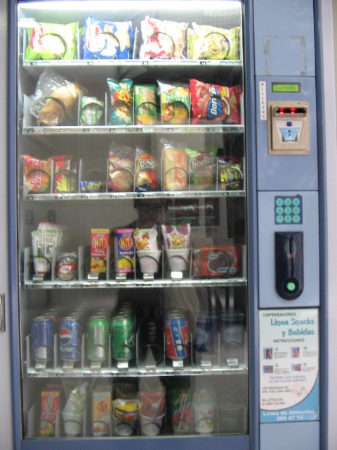 an automated refrigeration unit with various types of foods and beverages