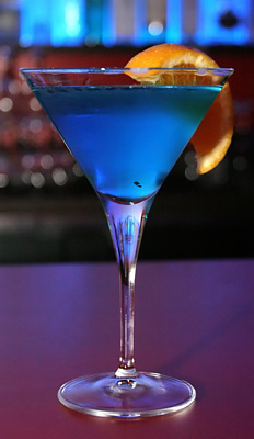 the blue cocktail is served on the table