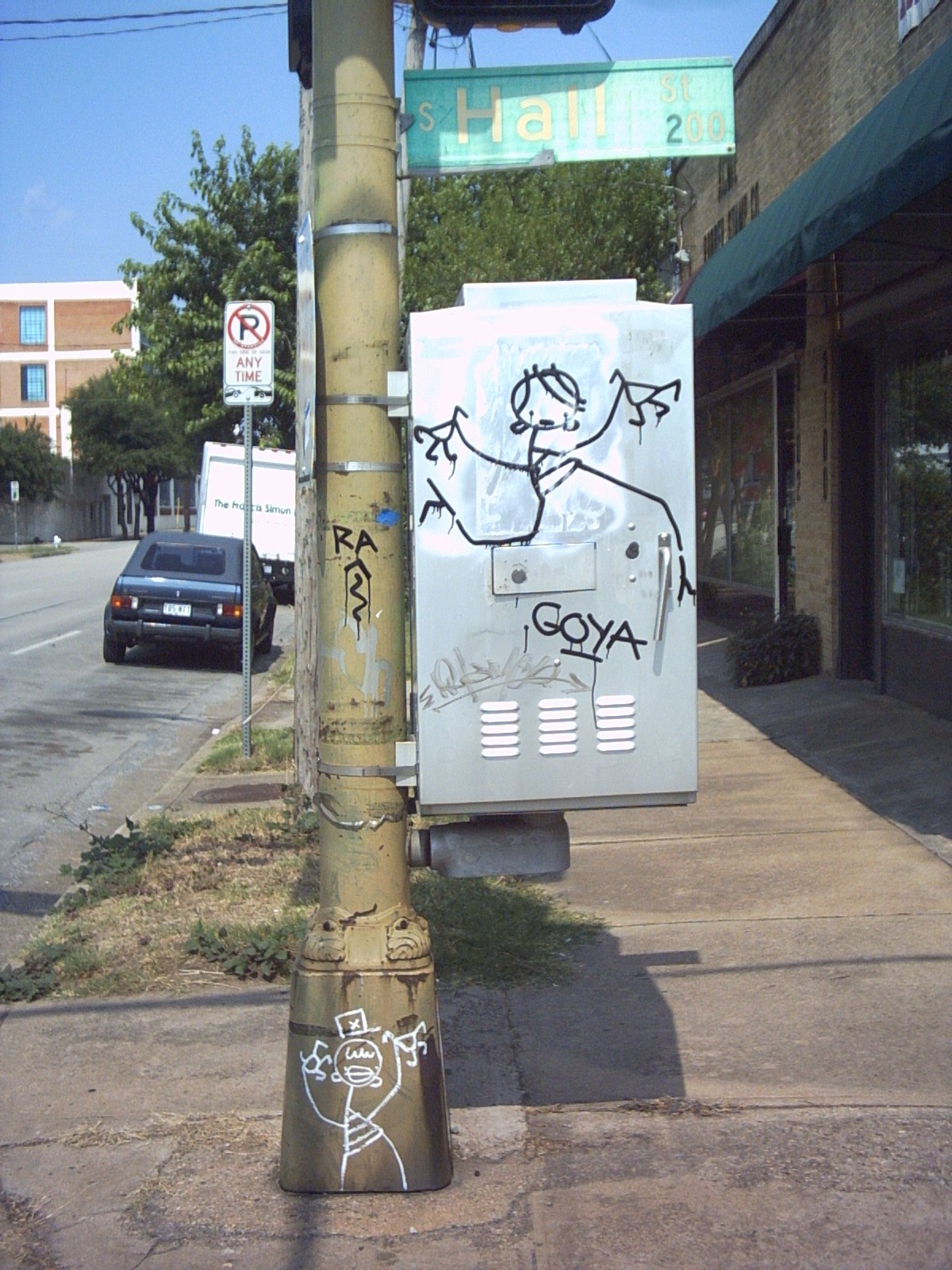 a pole that has some graffiti on it