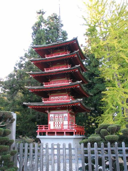 a tall pagoda with lots of red and white decorations