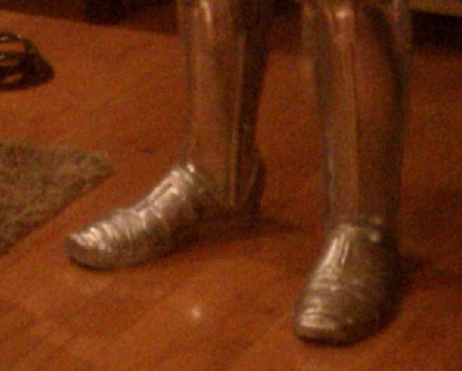 silver shoe covered boots with very high heel