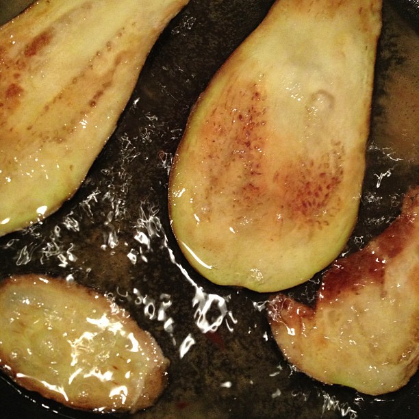 cooked pieces of potatoes fry in oil on a pan