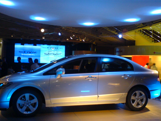 a car is displayed at an automobile show