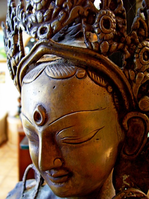 a close - up of the head and shoulders of an antique statue