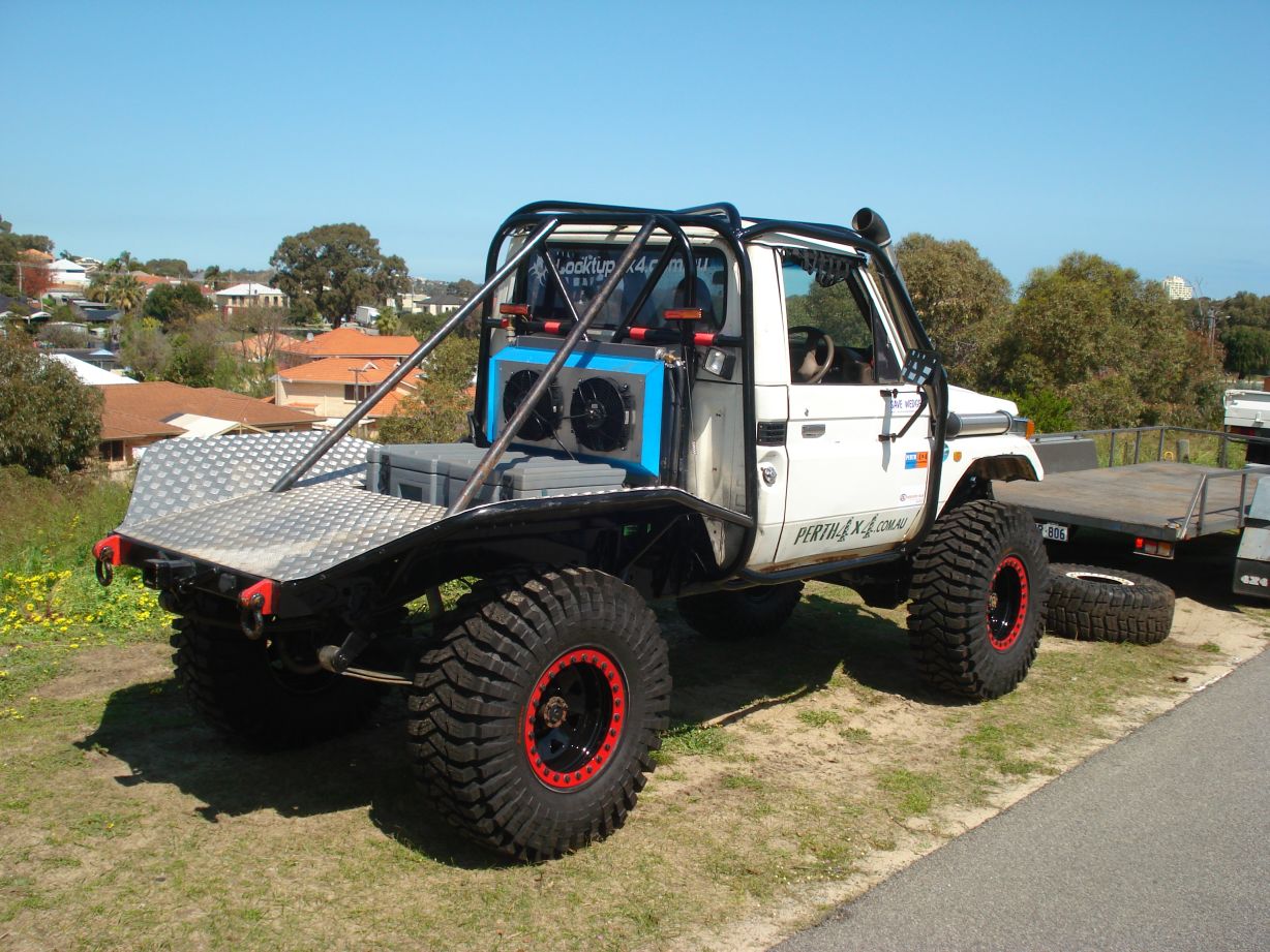 an off road vehicle has a truck bed in the back