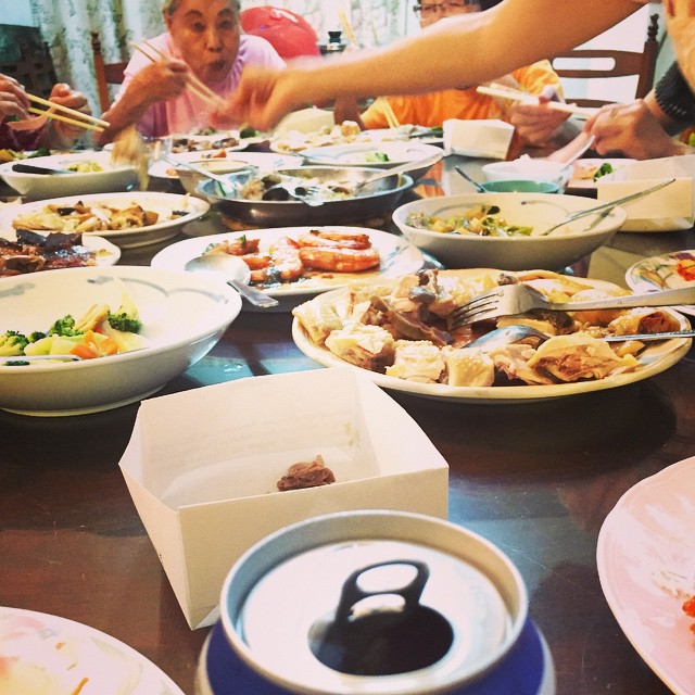 the group of people are eating and eating at the table