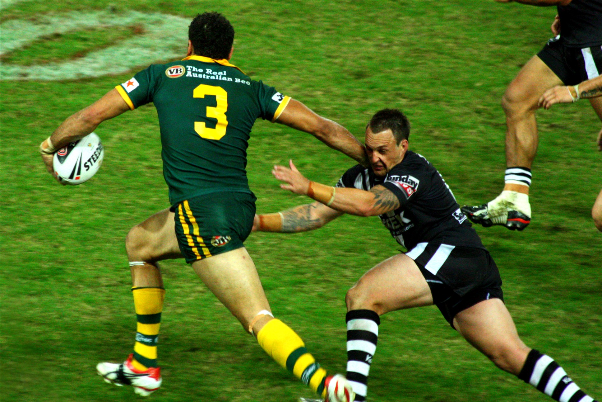 the rugby players are running after the ball