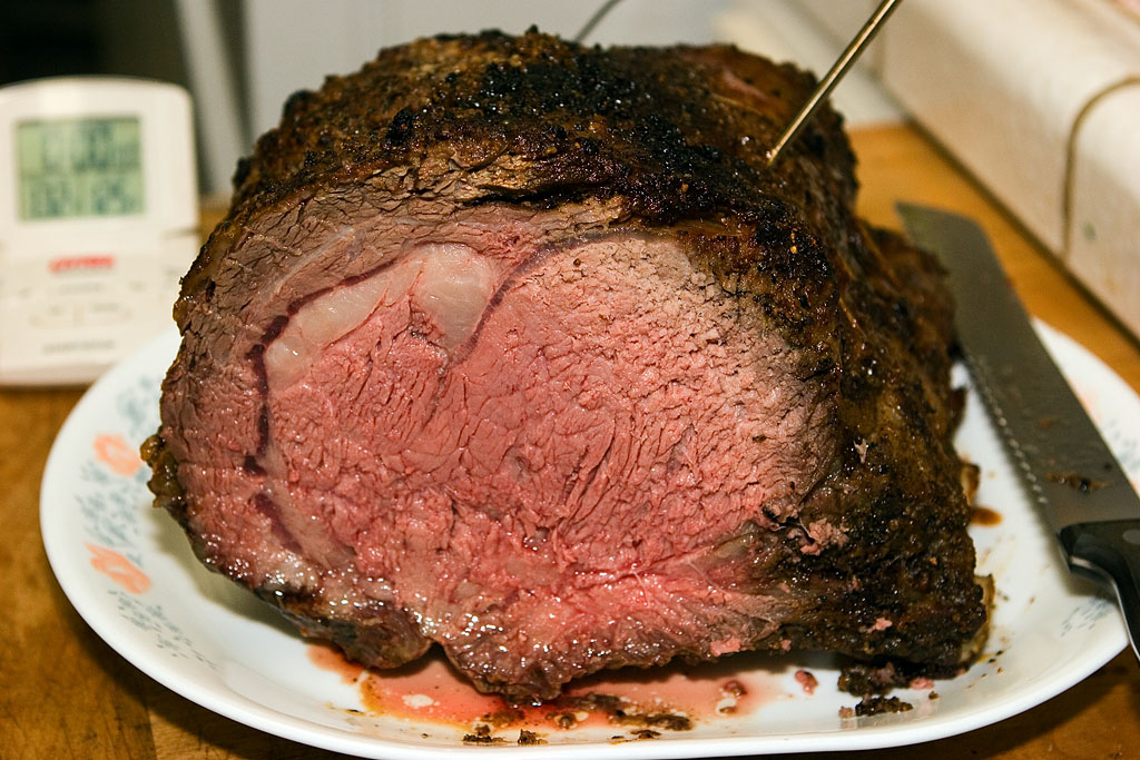 a cooked meat is being cut into by a person