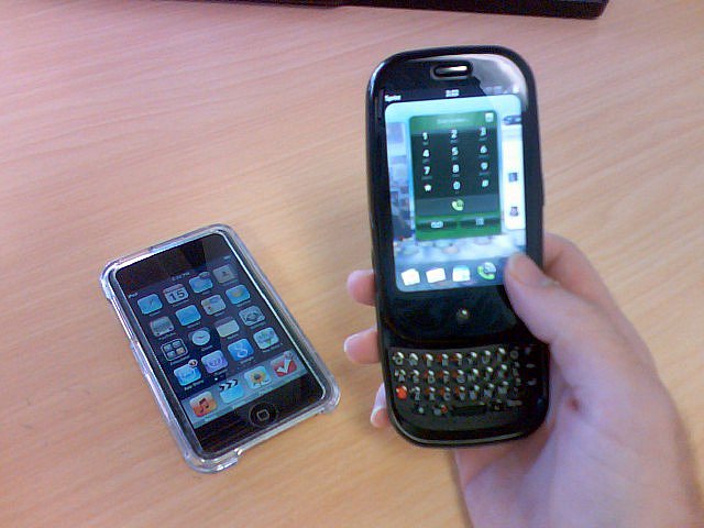 two phones are connected together, one is a blackberry