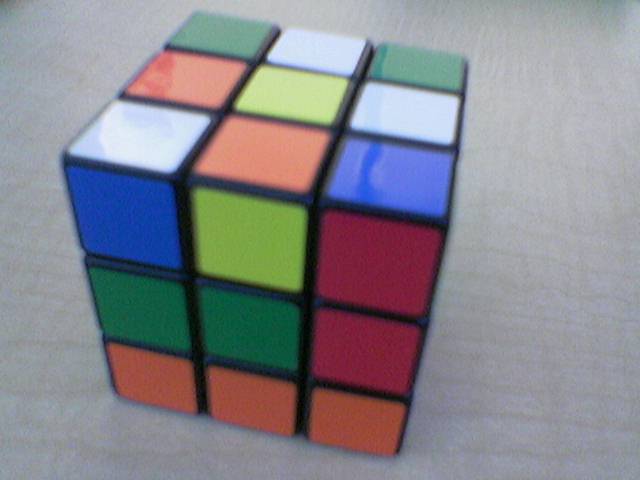 a rubik cube sitting on top of a table
