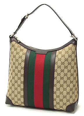 a bag with an open top and two handles, it is brown, green and red