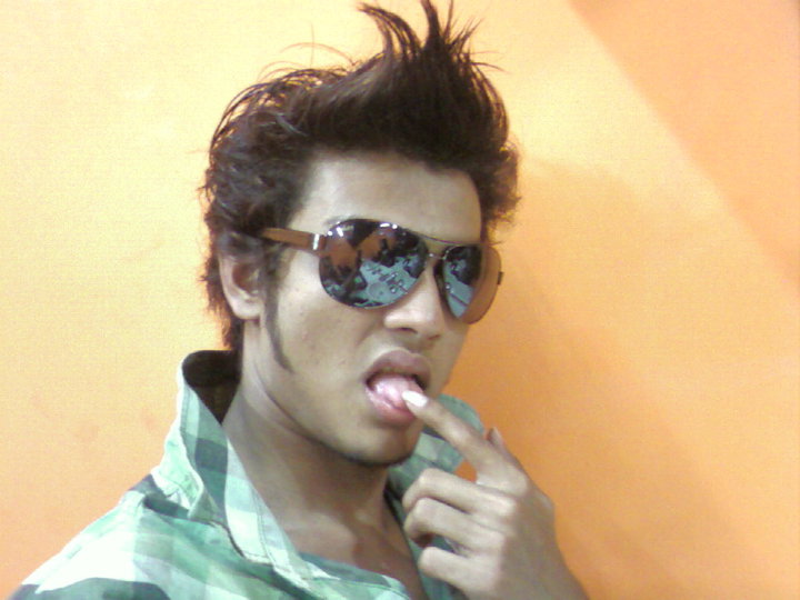 a young man with sunglasses and shades brushing his teeth