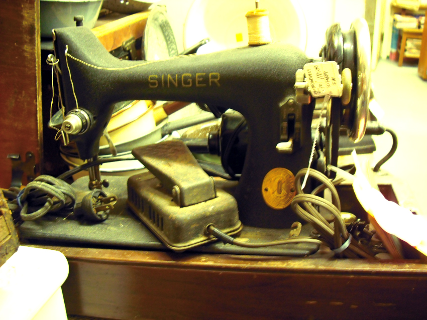 an old sewing machine and other junk that is part of a collection