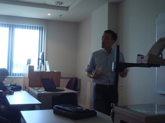 a man giving a presentation at an office