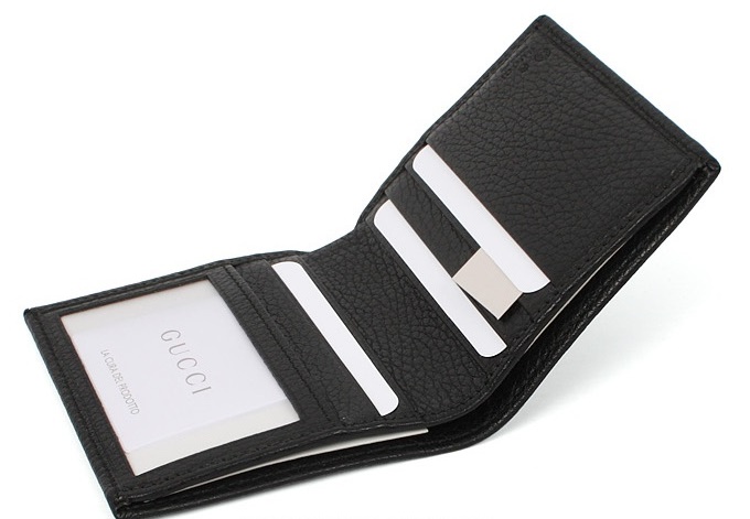 an open black leather wallet is shown on a white background