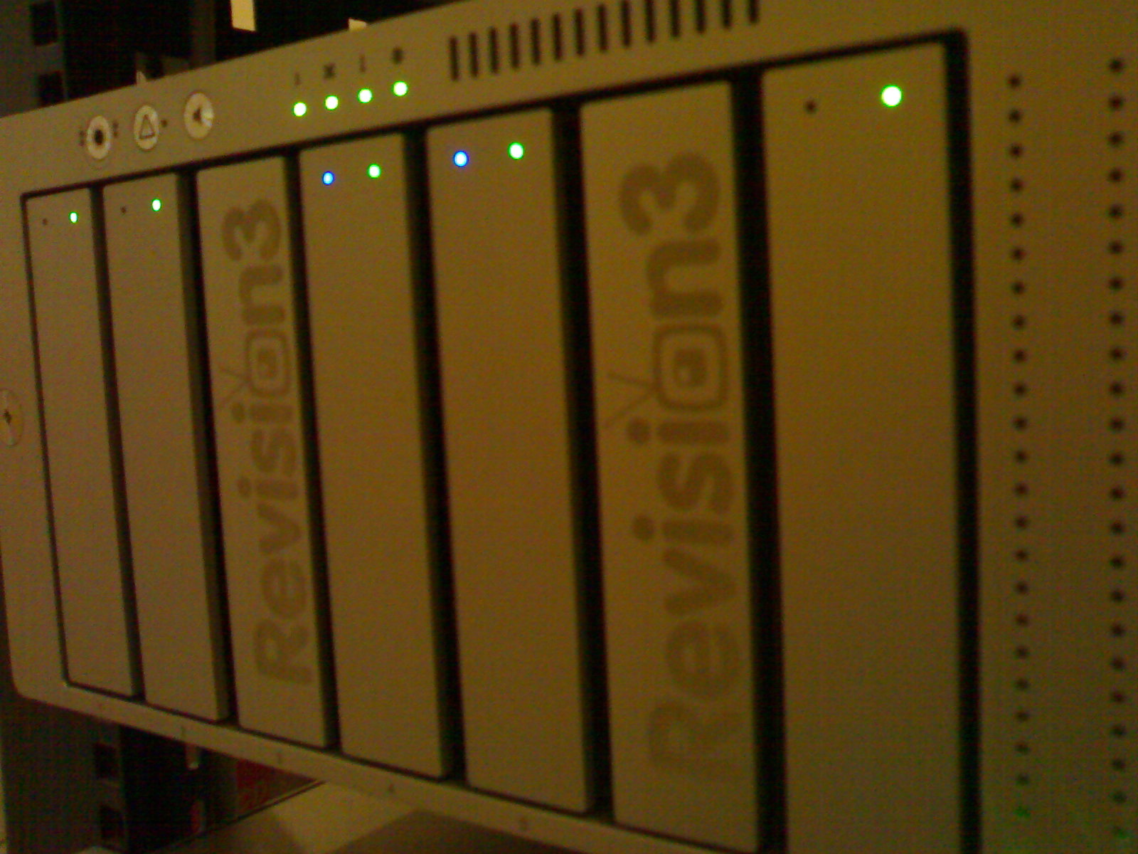 a display with several white servers in a room
