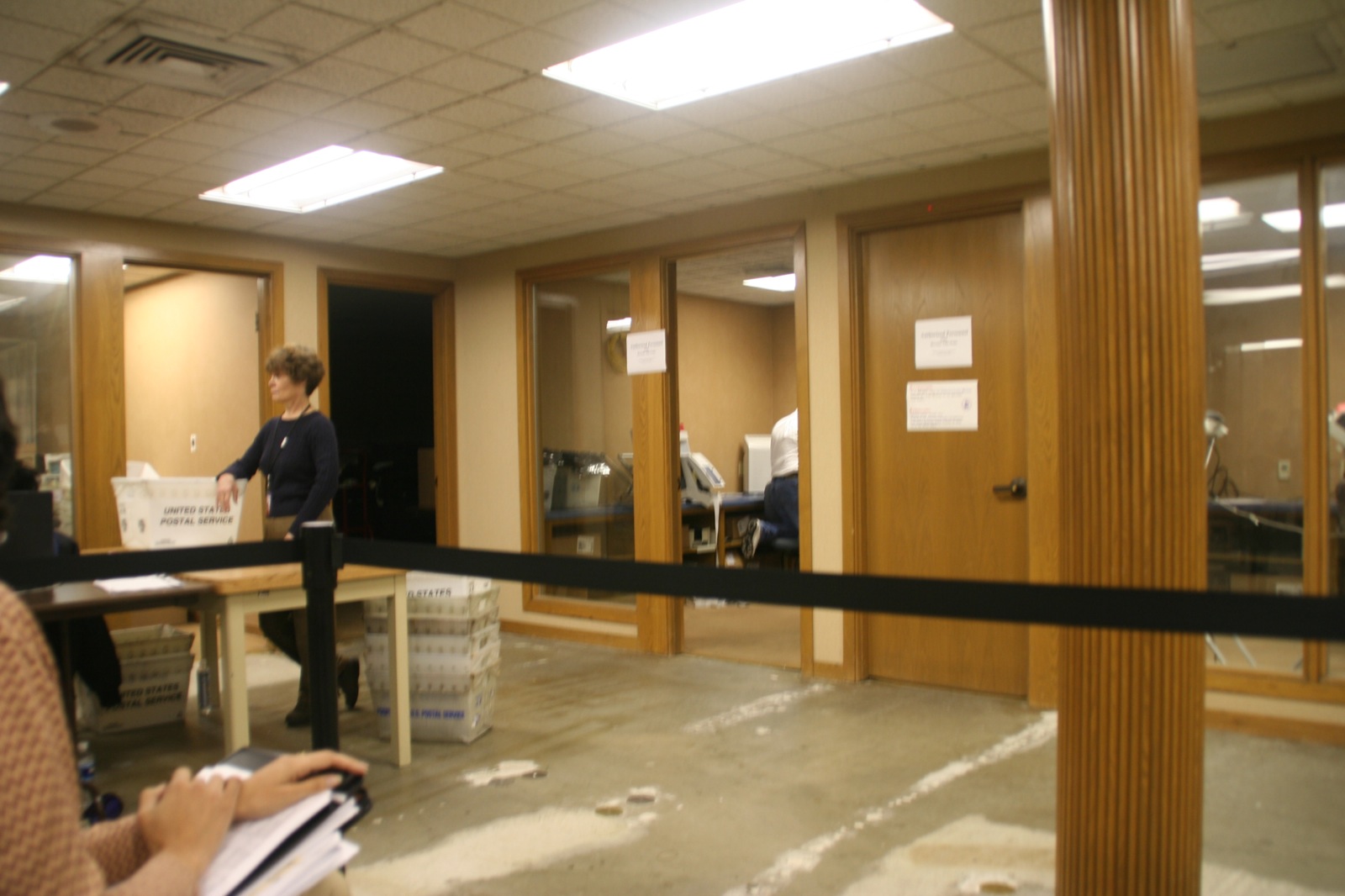 a woman at an office building reading a book