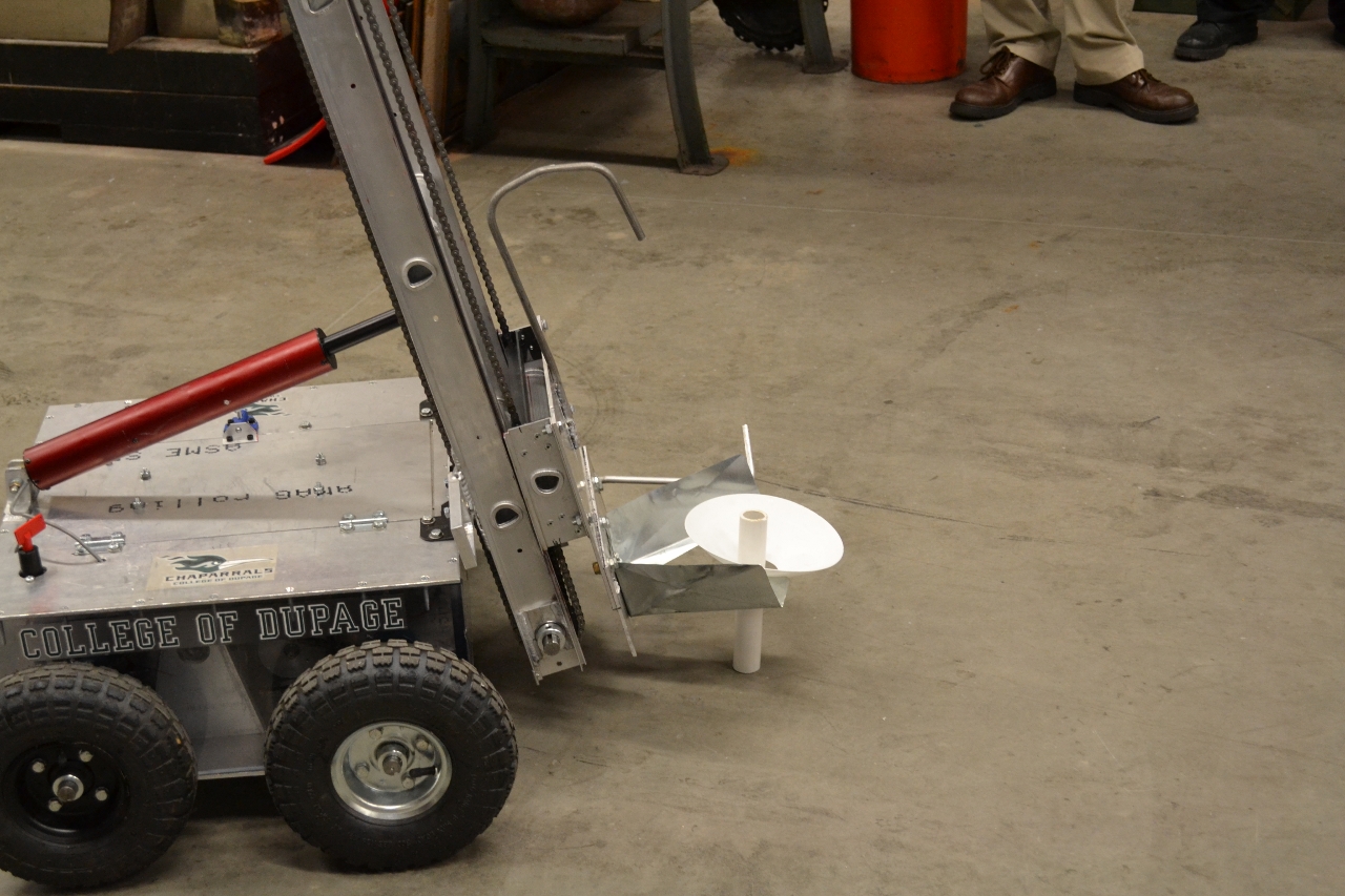 a large metal object on wheels in a room