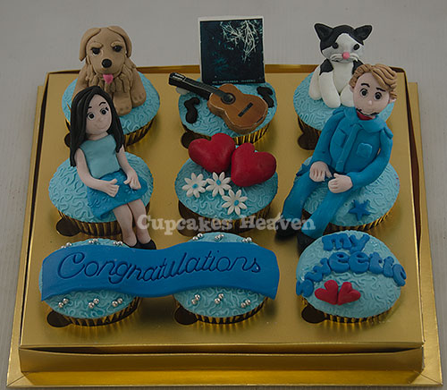 the cupcakes are decorated with dogs, flowers and girl's names