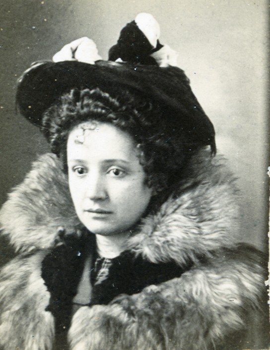 an old po of a woman in a fur coat and hat