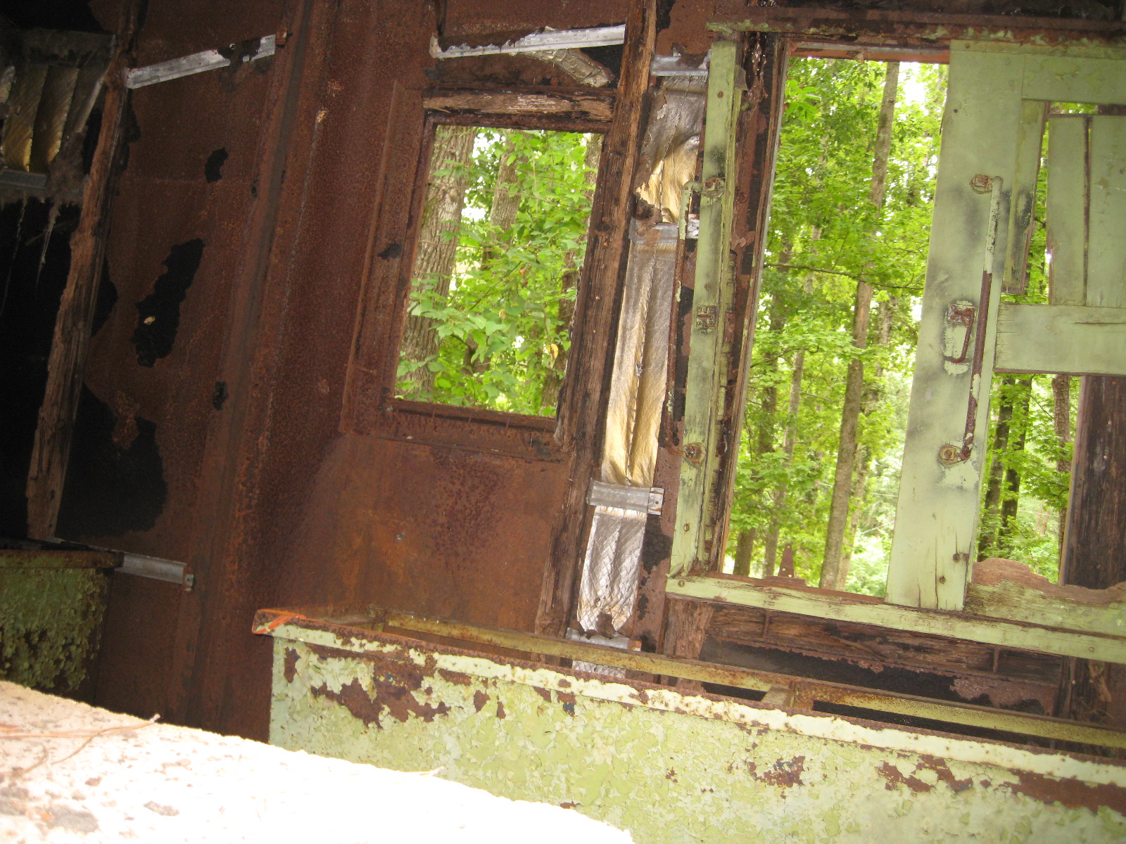 the door and window frames of an old abandoned house