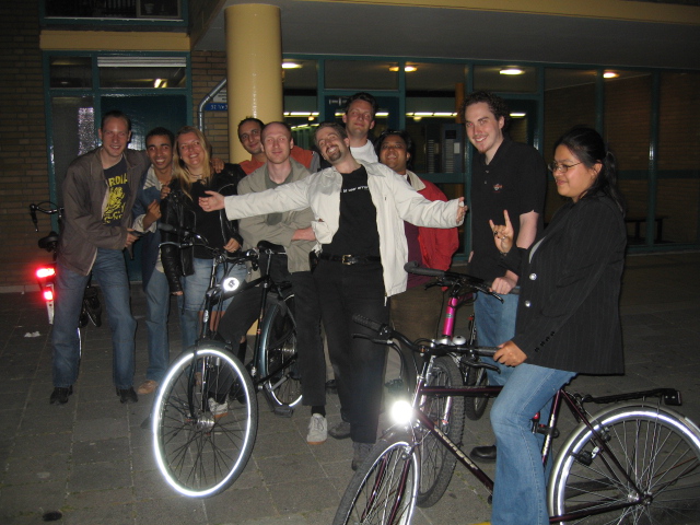 a group of people pose with their bikes