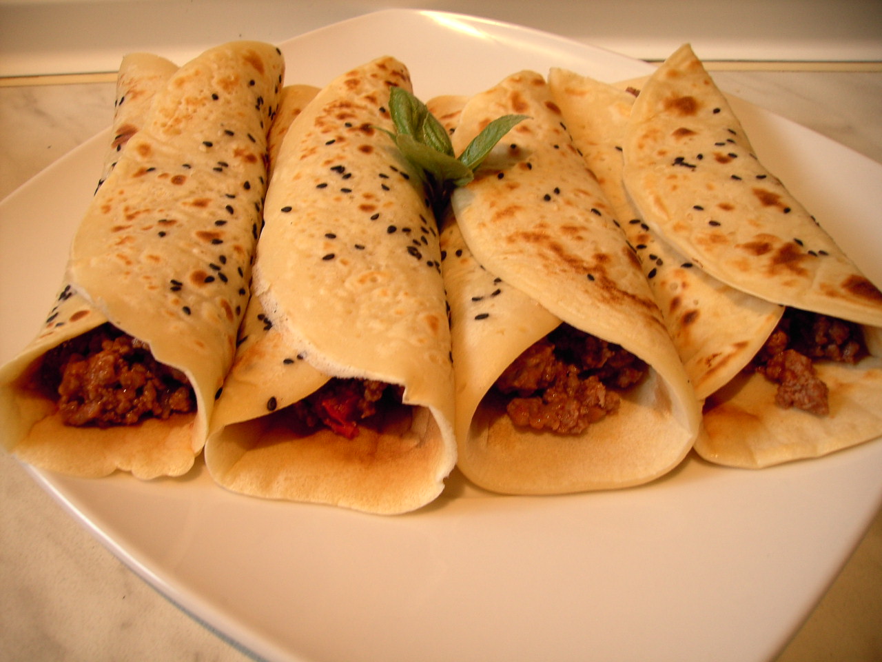 this is an image of a plate of burritos