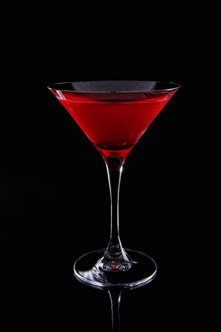 a red martini sitting on top of a table